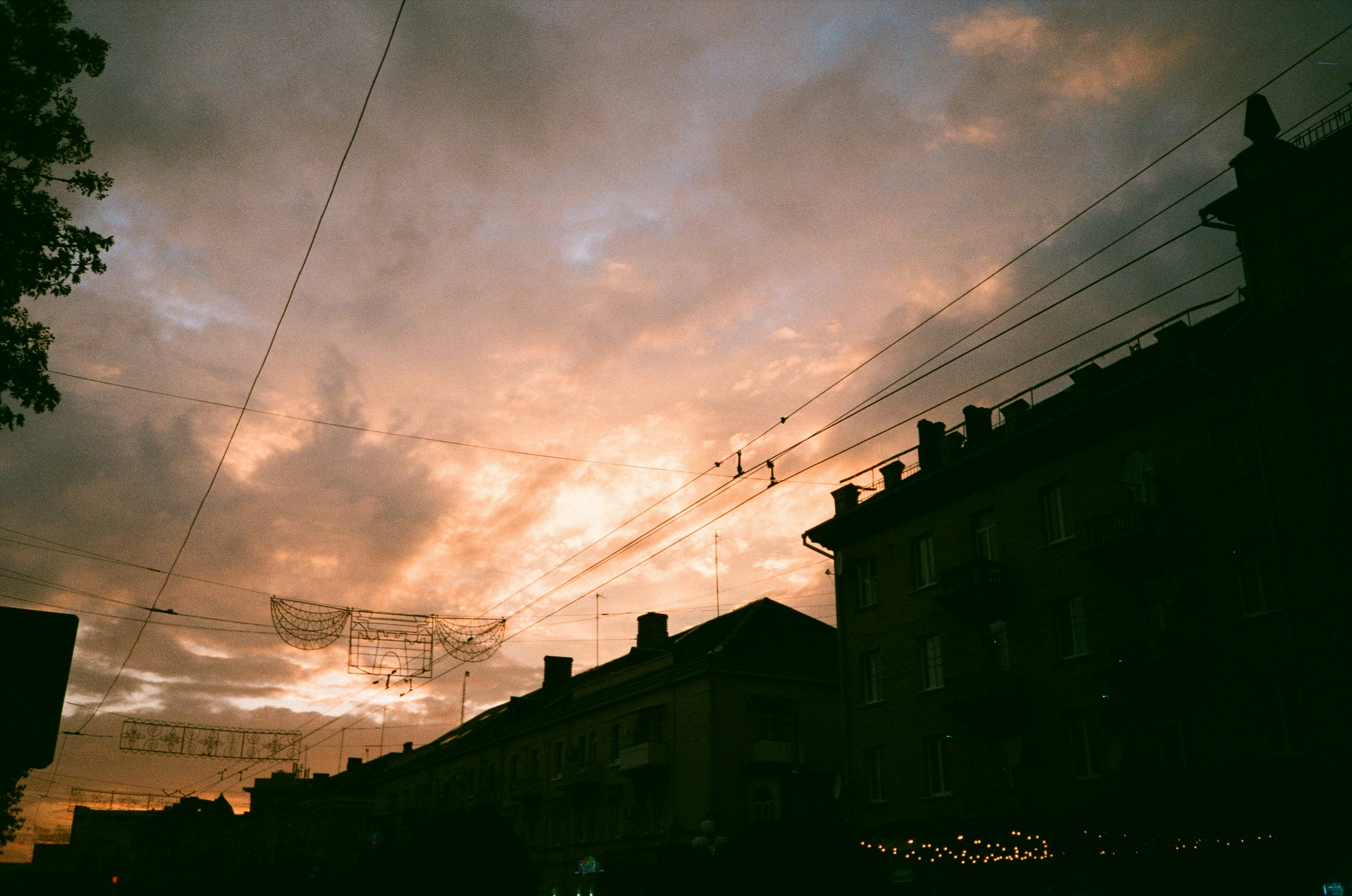 silhouette of buildings under cloudy sky during daytime